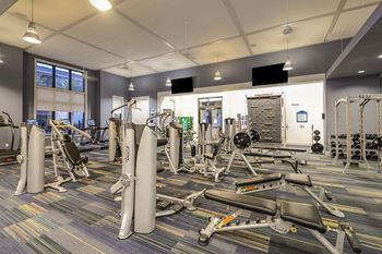 a room filled with lots of different types of exercise equipment  at Cabana Club - Galleria Club, Jacksonville, FL