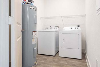 a room with a washer and dryer in it  at Fountainhead, Jacksonville, Florida