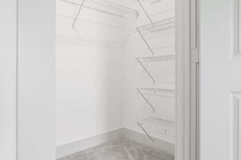 a small closet with white walls and a white door  at Fountainhead, Jacksonville