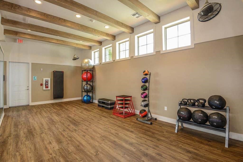 a room with a bunch of weights and mirrors in it  at Palm Bay Club, Jacksonville, Florida