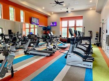 a gym with treadmills and other exercise equipment  at Hacienda Club, Florida