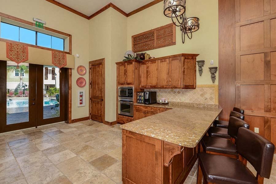 a kitchen with a counter top next to a doorway  at Hacienda Club, Jacksonville, FL, 32256