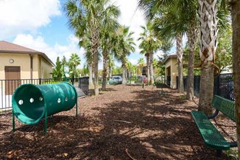 a park with a playground and palm trees  at Hacienda Club, Jacksonville