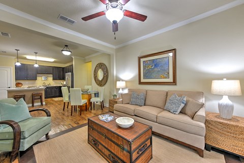 a living room with a couch and a ceiling fan at Hacienda Club, Florida
