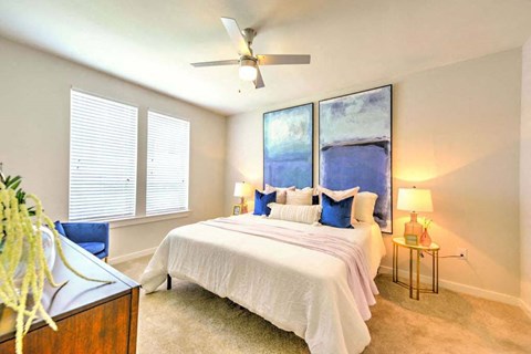 a bedroom with a bed and a ceiling fan  at Luxor Club, Jacksonville