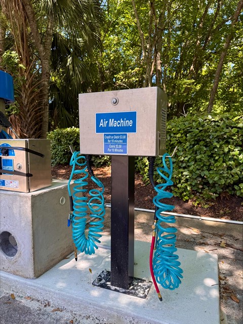 An air machine is located in a concrete box.