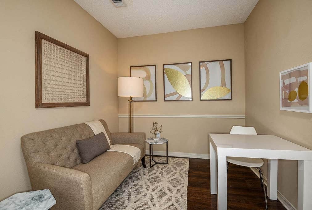 a living room with a couch and a table  at Ocean Park, Jacksonville Beach, FL, 32250