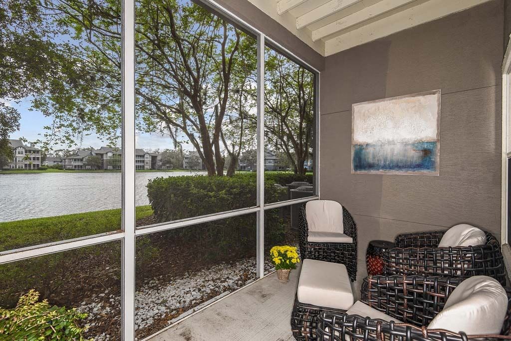 a screened in porch with two chairs and a couch  at Ocean Park, Florida