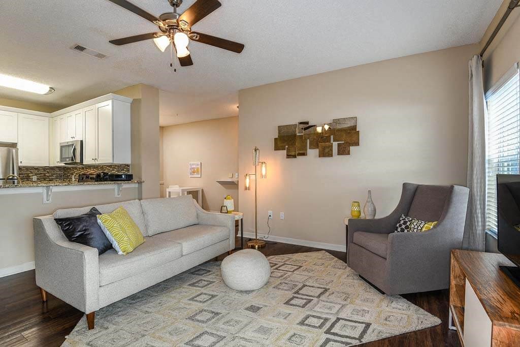 a living room with a couch and a chair  at Ocean Park, Florida, 32250