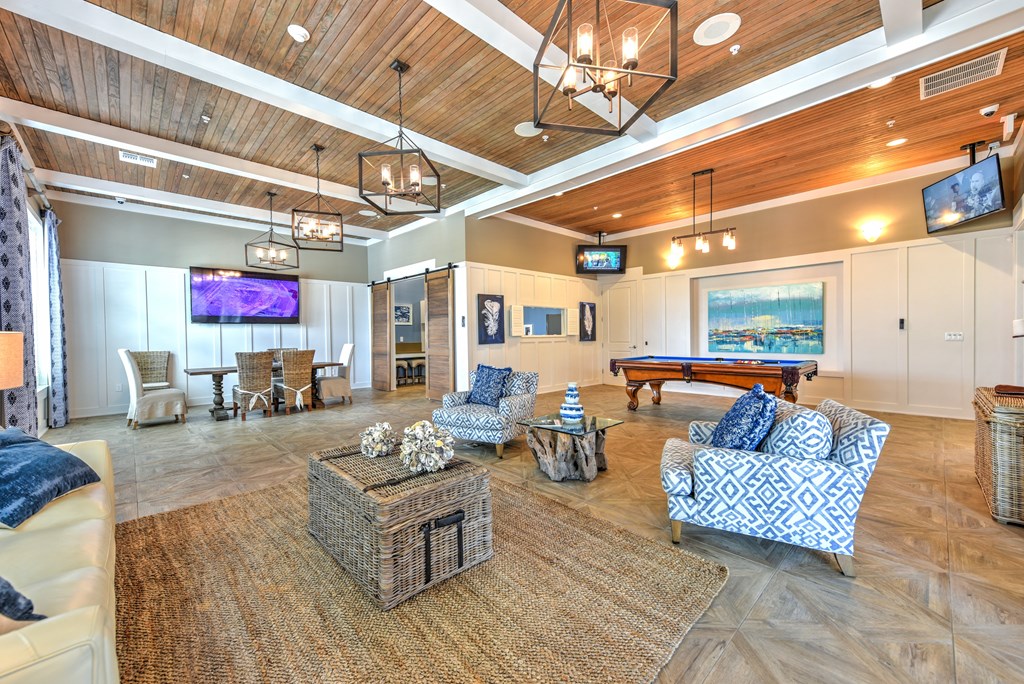 a resident clubhouse with a pool table and flat screen tvsat Palm Bay Club, Jacksonville, FL