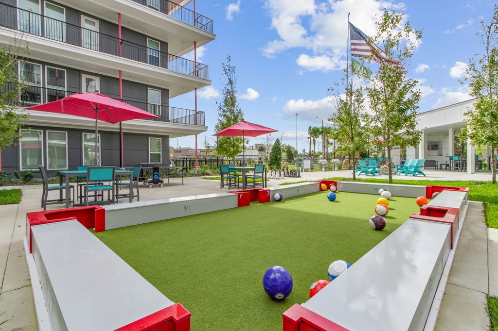 A playground with a slide, ball pit, and climbing wall.at Pinnacle Apartments, Jacksonville, FL