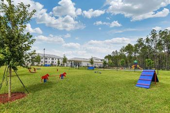a playground in front of a large building  at Palm Bay Club, Jacksonville, 32258