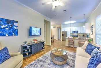 a living room with a couch and a table  at Palm Bay Club, Jacksonville
