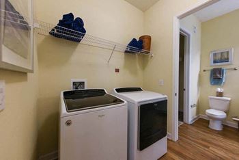 a laundry room with a washer and dryer  at Palm Bay Club, Florida, 32258