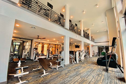 the spacious fitness center has a treadmill, elliptical and other exercise equipment  at Fusion, Florida, 32256