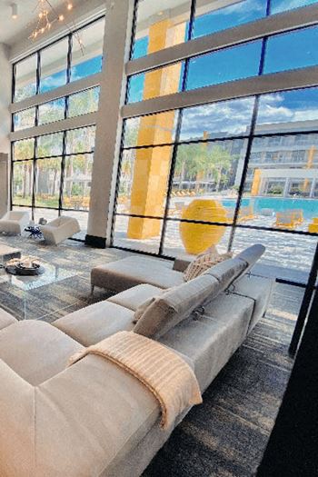 a living room filled with furniture and a large window  at Fusion, Florida, 32256