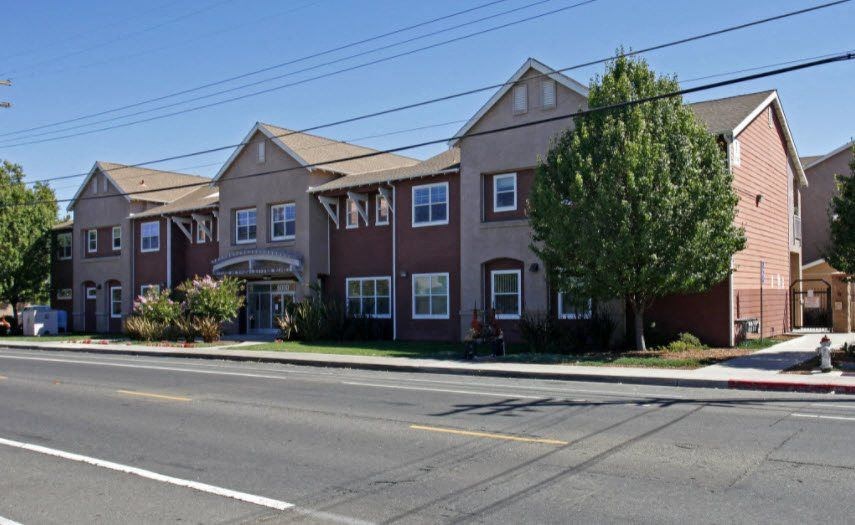 a row of houses on the side of a street