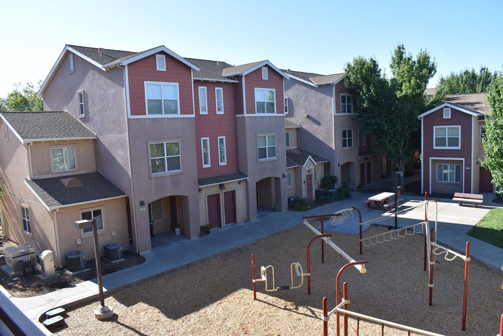 an aerial view of an apartment complex with a playground