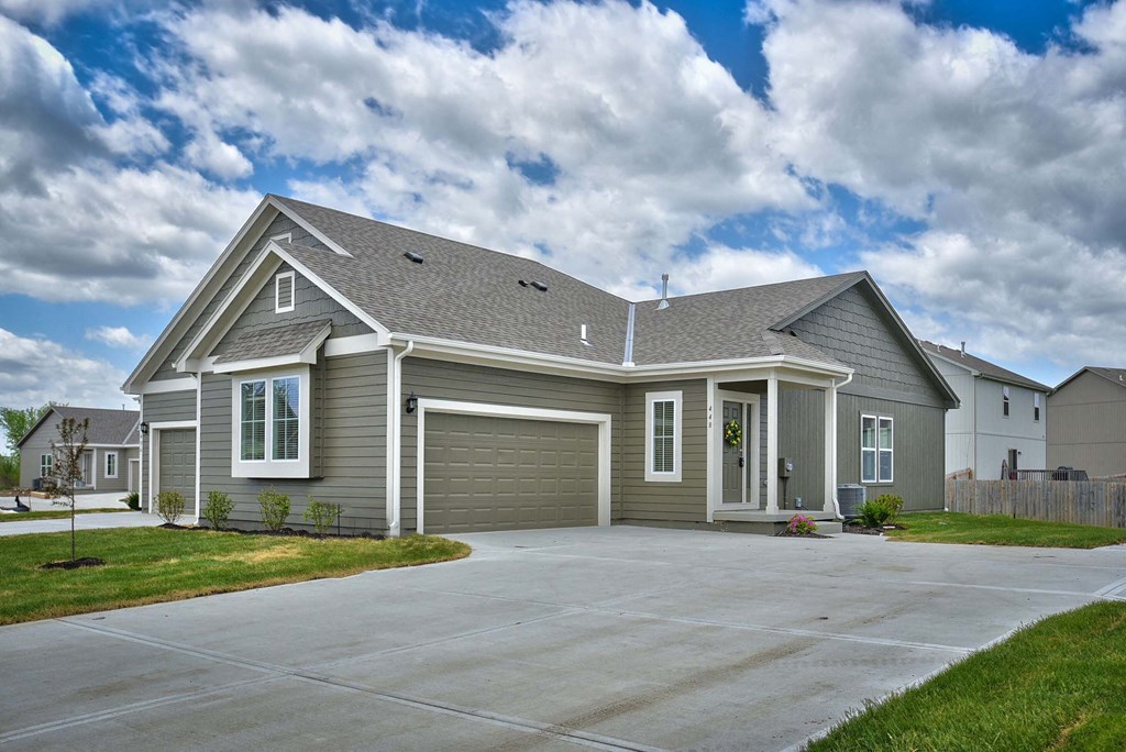 a house with a driveway and a garage door