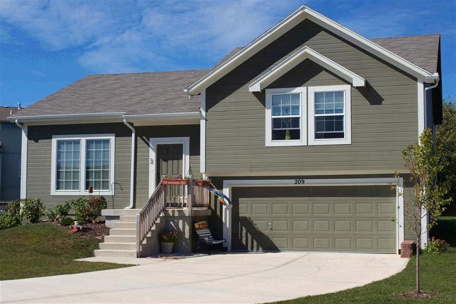 a house with a driveway and a garage door