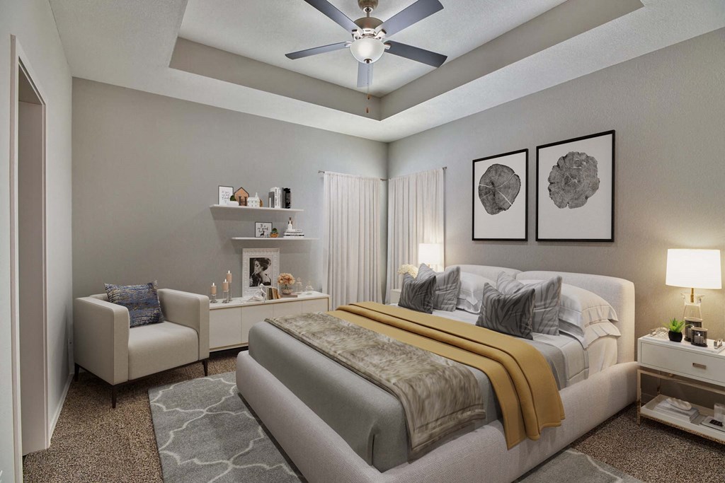 a bedroom with a bed and a ceiling fan