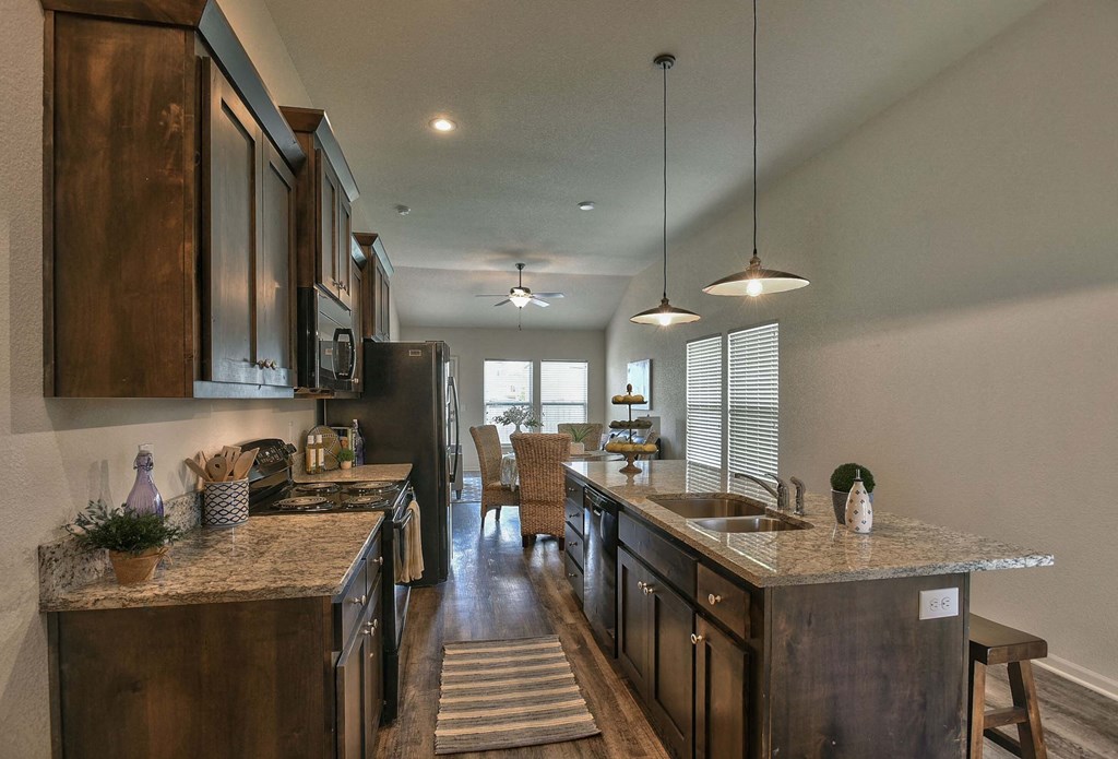 a kitchen with wooden cabinets and a counter top