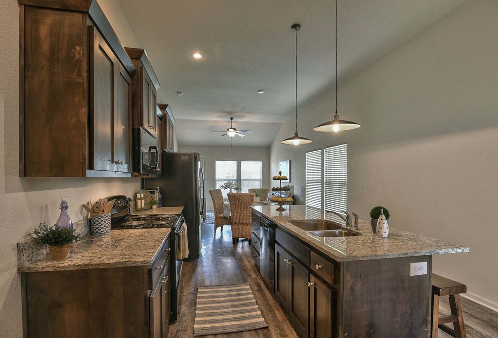a kitchen with wooden cabinets and a counter top