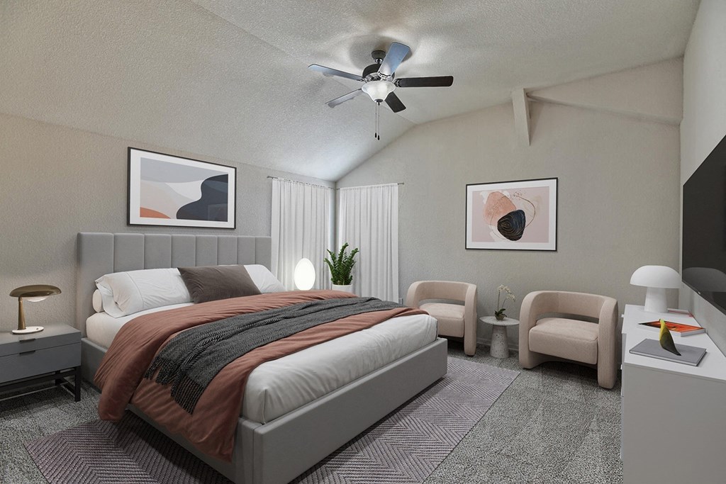a bedroom with a bed and a ceiling fan