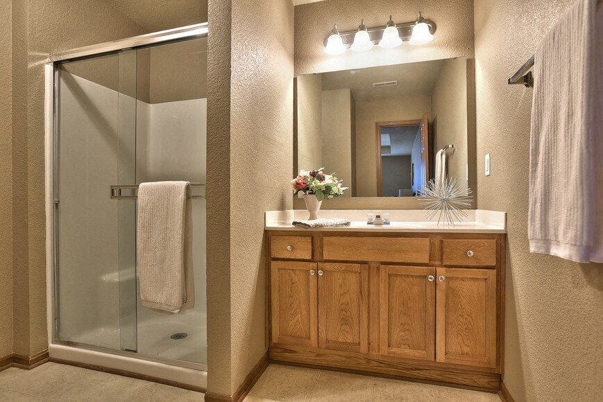 a bathroom with a sink and a shower