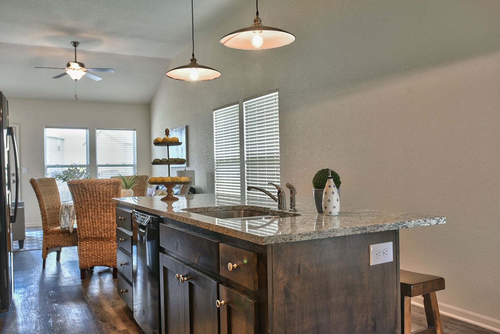 a kitchen with a sink and a counter top
