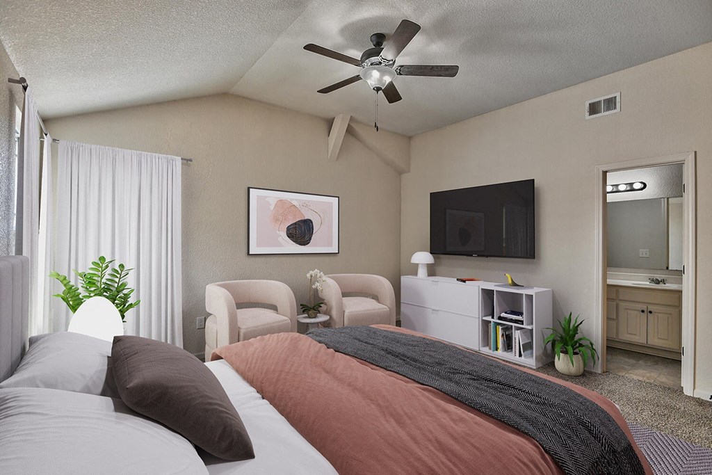 a bedroom with a bed and a ceiling fan