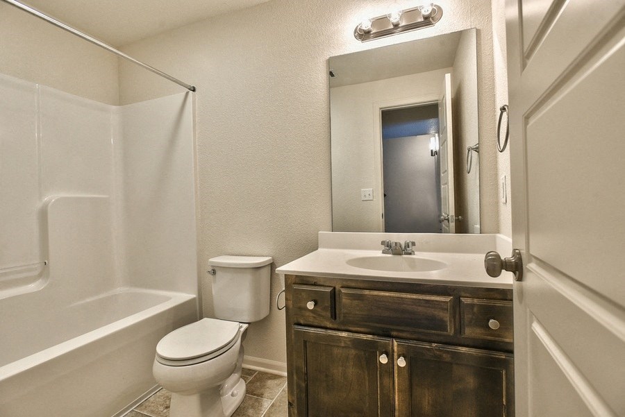 a bathroom with a sink toilet and a shower