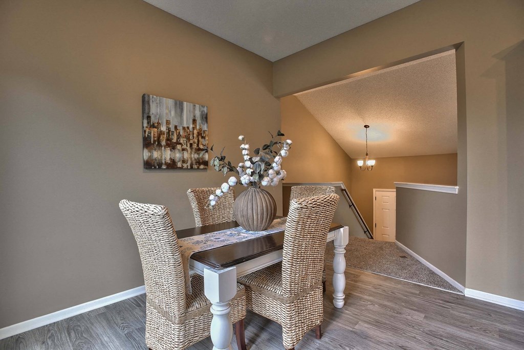 a dining room with a table and chairs