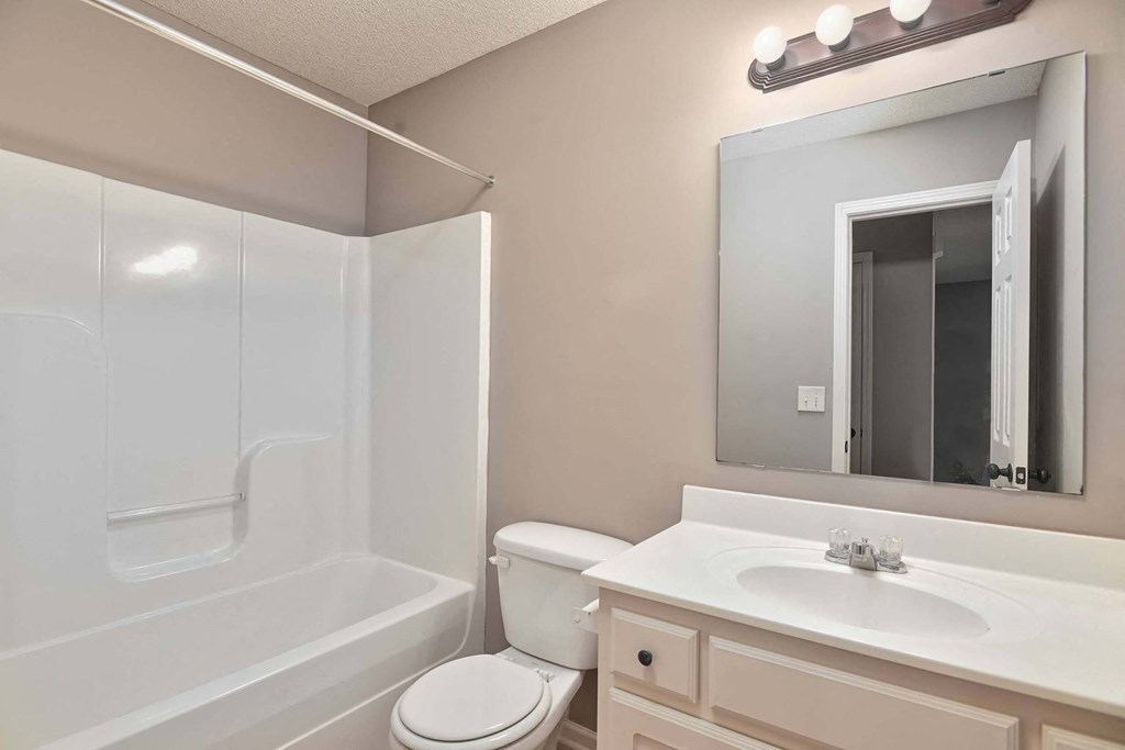 a bathroom with a sink toilet and a shower