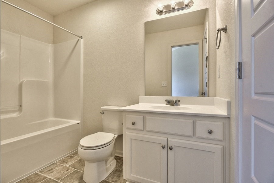 a bathroom with a sink toilet and a shower