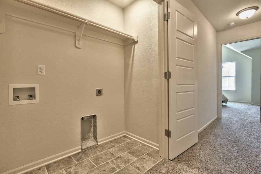 the entrance to a room with a closet and an open door
