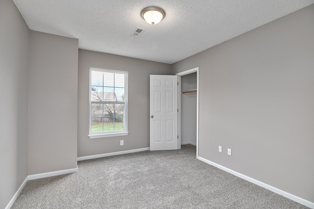 A room with a door and a window.