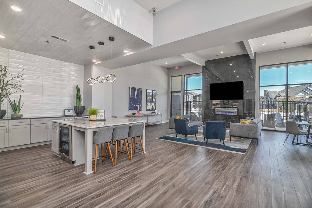 a living room with a kitchen and a dining room
