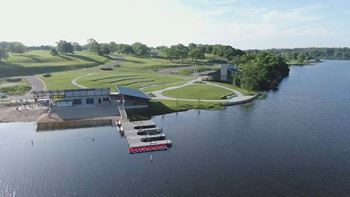 a boat is docked in the water near a pier