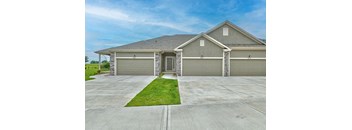 a house with a driveway and a garage door
