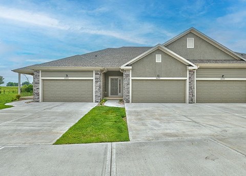 a house with a driveway and a garage door