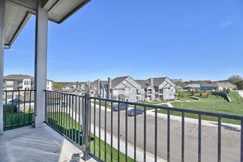 a balcony with a view of some houses