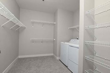 a laundry room with a washer and dryer in it