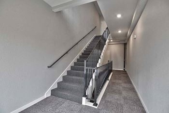 a staircase in a building with a railing and