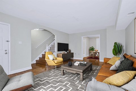 a living room with a couch and a table