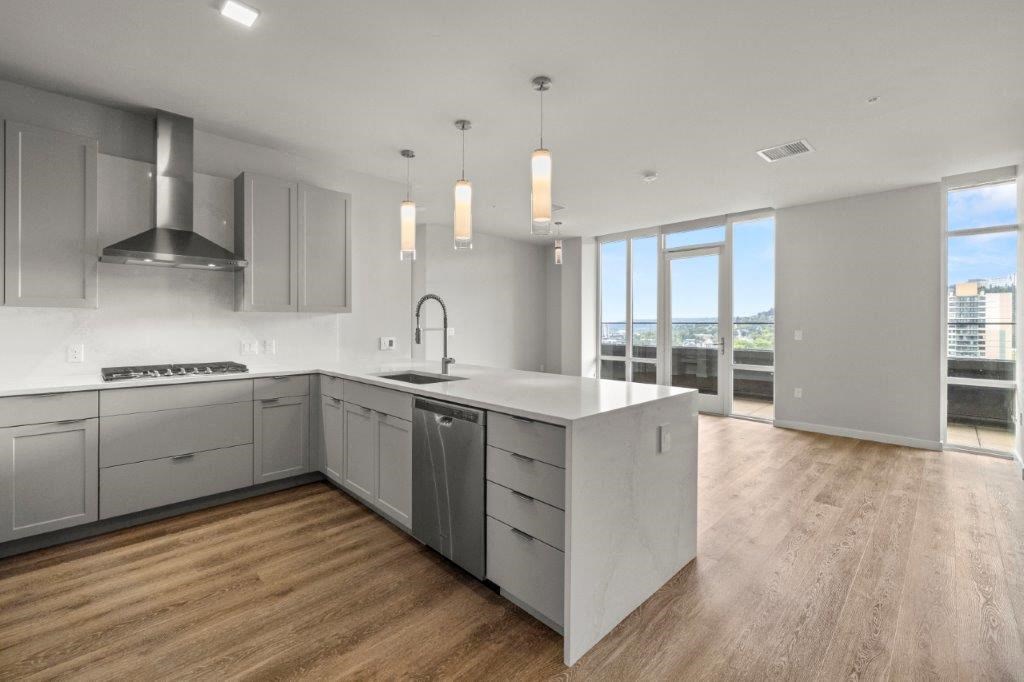 a large kitchen with a large island in the middle of it