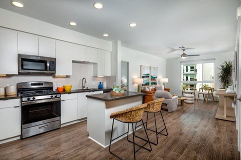 a kitchen and living room with an open floor plan