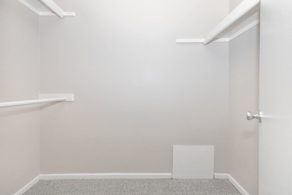 A white door is on the right side of a room.