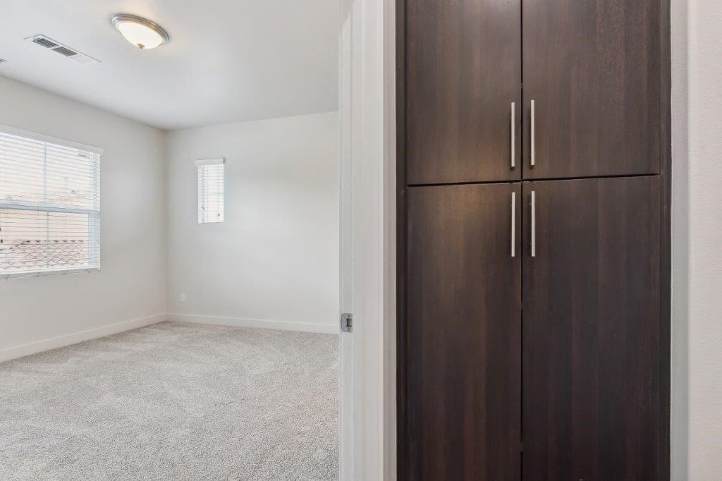 a room with a closet and a window and a door