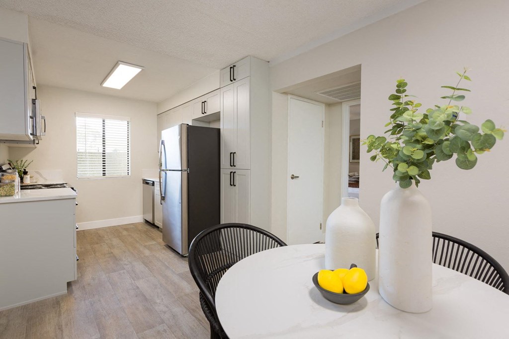 a kitchen and dining area in a 555 waverly unit